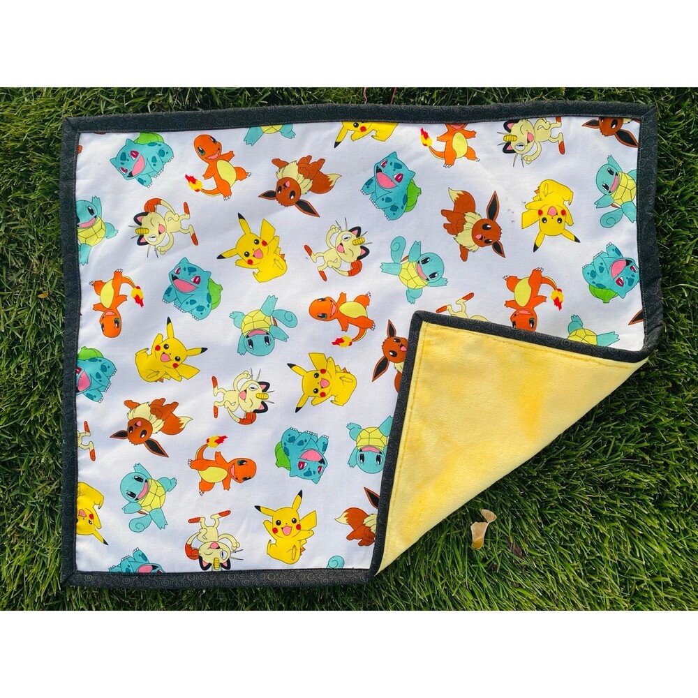 Pokémon doll quilt with a yellow Minky back 22”x18”